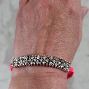 AERO faux silver and diamond Pull String bracelet.